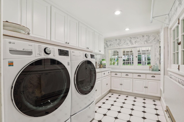 clothes washing area with washing machine and dryer, recessed lighting, cabinet space, light floors, and wallpapered walls