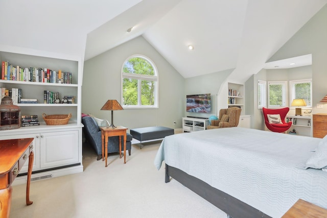 bedroom with visible vents, vaulted ceiling, and light colored carpet