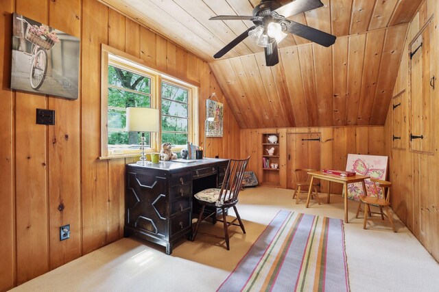 office featuring lofted ceiling, ceiling fan, wooden ceiling, carpet floors, and wood walls