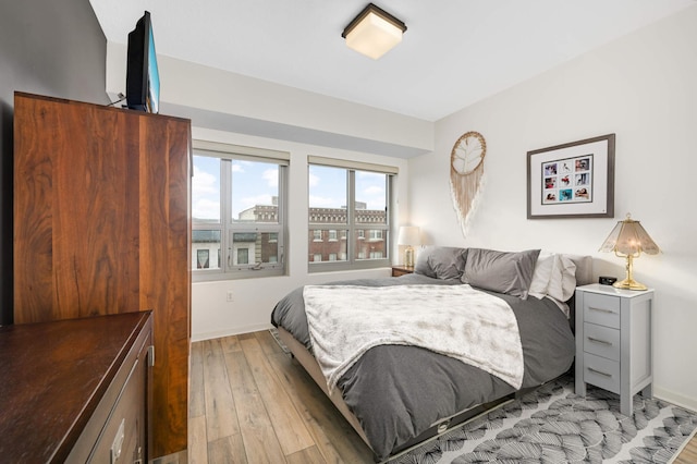 929 Portland Ave Unit 309, Minneapolis, MN 55404 - bedroom featuring light wood-style flooring and baseboards