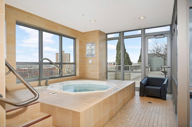 929 Portland Ave Unit 309, Minneapolis, MN 55404 - bathroom featuring tile patterned floors, a relaxing tiled tub, and recessed lighting