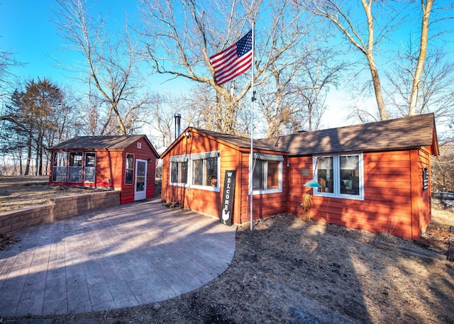 view of front of property with an outbuilding and board and batten siding