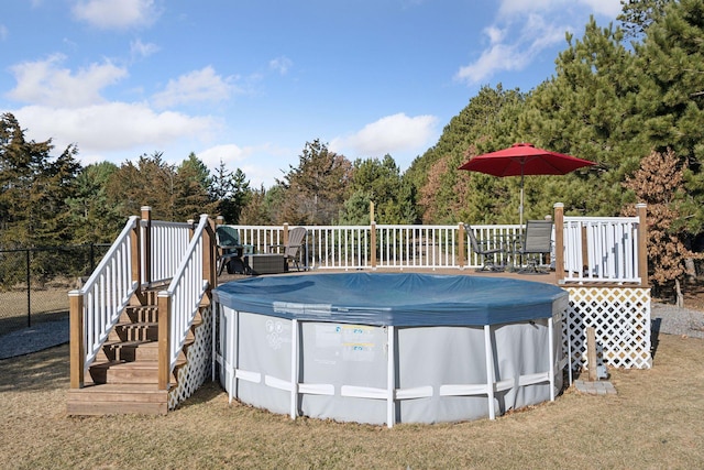 view of swimming pool featuring a wooden deck