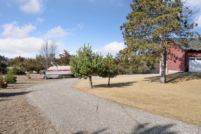 view of road with driveway