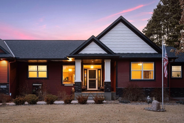 view of front of home featuring roof with shingles