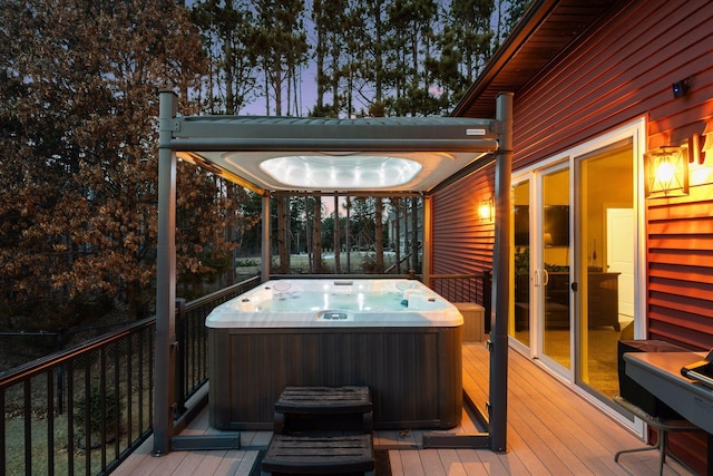 wooden terrace with a hot tub