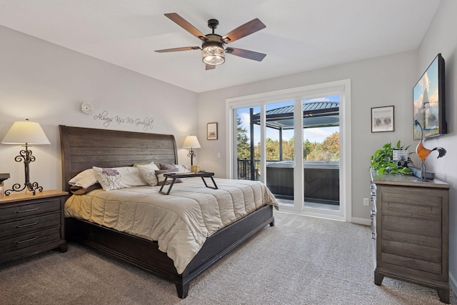 bedroom with a ceiling fan, access to exterior, light colored carpet, and baseboards