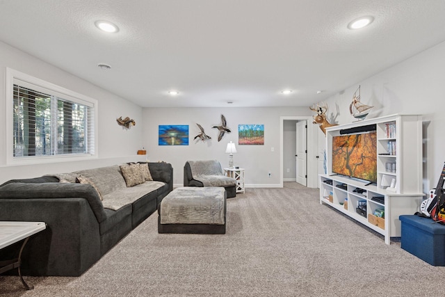 living room with carpet flooring, recessed lighting, a textured ceiling, and baseboards