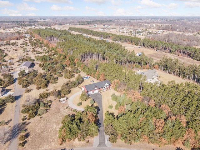 drone / aerial view with a view of trees