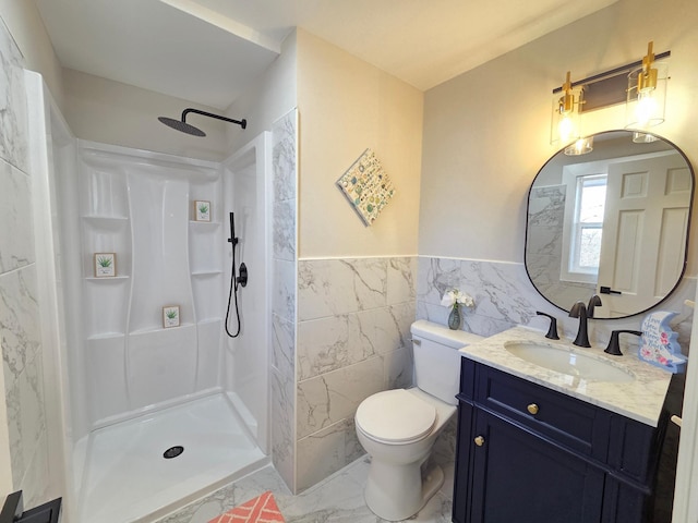 bathroom with marble finish floor, tile walls, toilet, vanity, and walk in shower