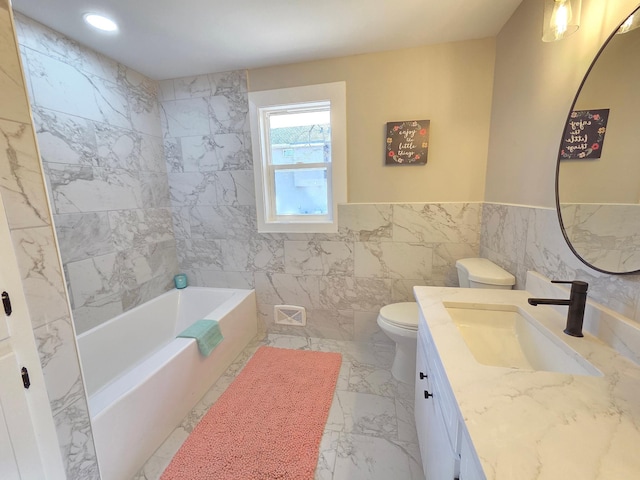 full bath with toilet, a bath, marble finish floor, vanity, and tile walls