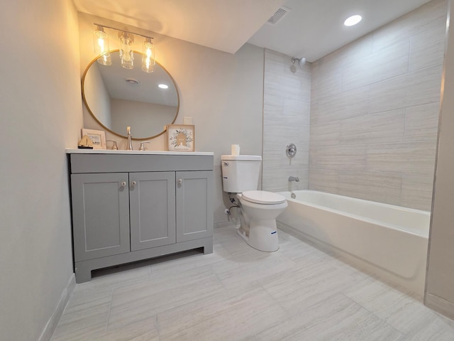 bathroom featuring shower / tub combination, toilet, vanity, visible vents, and baseboards