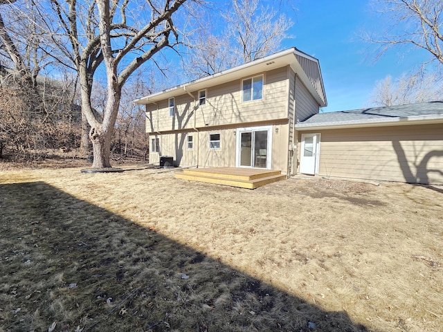 rear view of property featuring a deck