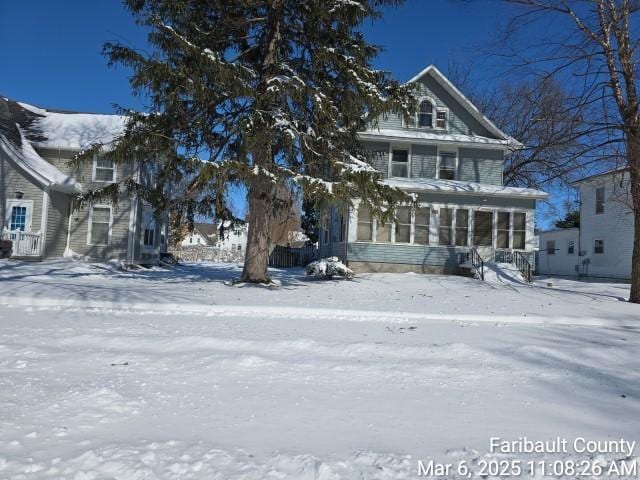 view of front of house with a sunroom