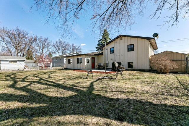 1422 24th Ave S, Moorhead, MN 56560 - back of house featuring board and batten siding and a patio area