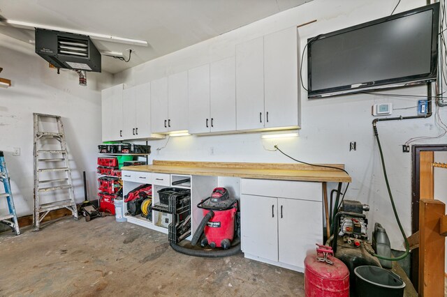 1422 24th Ave S, Moorhead, MN 56560 - garage with a workshop area and a heating unit
