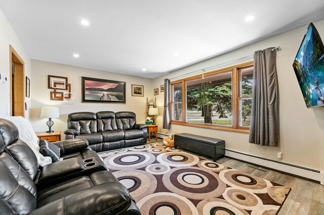 1422 24th Ave S, Moorhead, MN 56560 - living room featuring wood finished floors, recessed lighting, and baseboard heating