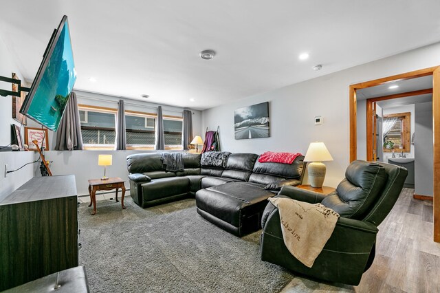 1422 24th Ave S, Moorhead, MN 56560 - living area featuring recessed lighting, wood finished floors, and a baseboard heating unit