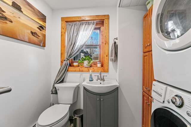 1422 24th Ave S, Moorhead, MN 56560 - bathroom featuring stacked washer / drying machine and vanity