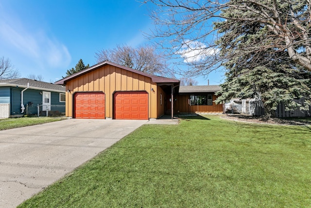 1422 24th Ave S, Moorhead, MN 56560 - ranch-style home with board and batten siding, an attached garage, and driveway