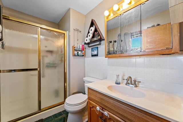 1422 24th Ave S, Moorhead, MN 56560 - full bath with vanity, a stall shower, decorative backsplash, and tile patterned flooring