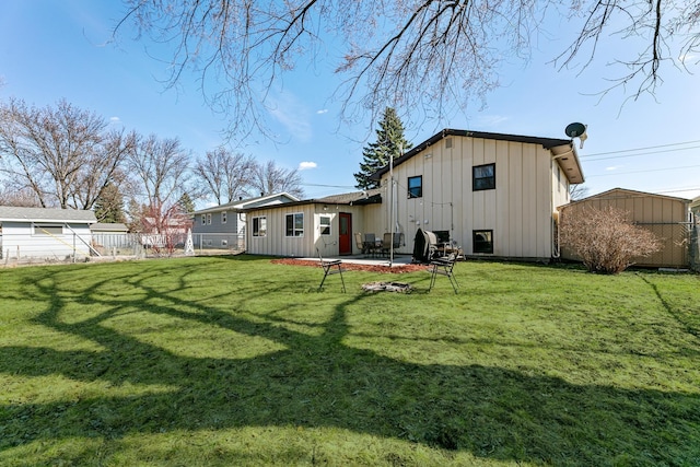 1422 24th Ave S, Moorhead, MN 56560 - rear view of house with board and batten siding and a patio