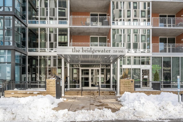 view of snow covered property entrance