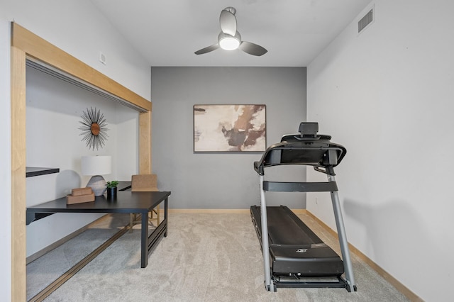 carpeted office with visible vents, ceiling fan, and baseboards