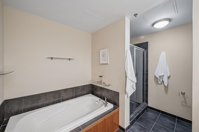 bathroom with tile patterned flooring, a shower stall, and a bath