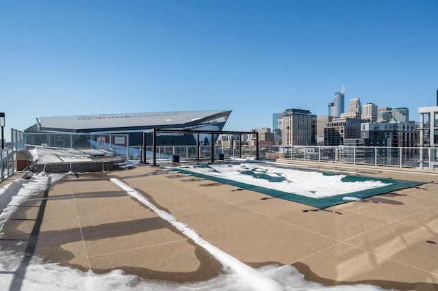 view of swimming pool featuring a city view