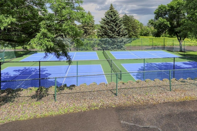 view of tennis court with fence