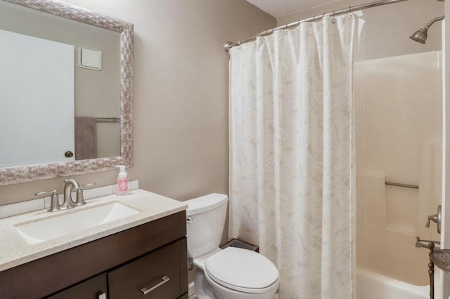 full bath with shower / tub combo, vanity, and toilet