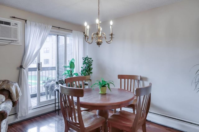 dining space with a chandelier, wood finished floors, baseboard heating, and a wall mounted AC