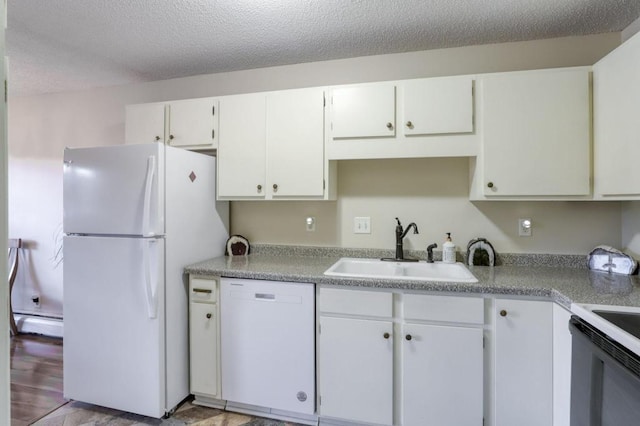 kitchen featuring a baseboard heating unit, white cabinetry, a sink, a textured ceiling, and white appliances