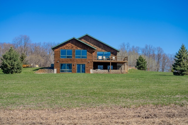 back of property featuring a yard and a wooden deck