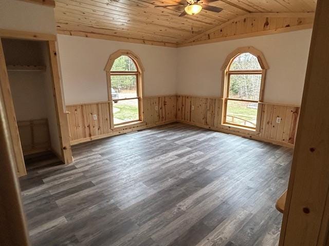 31154 Arbo Rd, Arbo Twp, MN 55744 - unfurnished bedroom with wood finished floors, lofted ceiling, and wainscoting