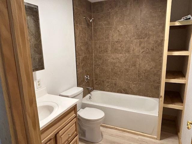 31154 Arbo Rd, Arbo Twp, MN 55744 - bathroom featuring toilet, shower / bath combination, vanity, and wood finished floors
