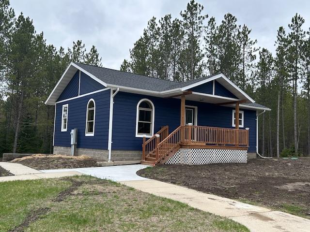 31154 Arbo Rd, Arbo Twp, MN 55744 - view of front facade featuring a porch