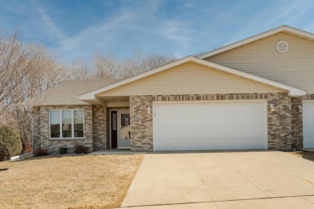 view of front of house featuring concrete driveway, an attached garage, brick siding, and roof with shingles