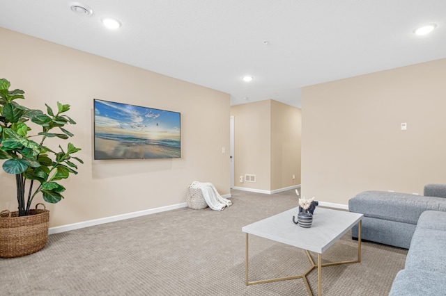 living area featuring visible vents, baseboards, carpet flooring, and recessed lighting