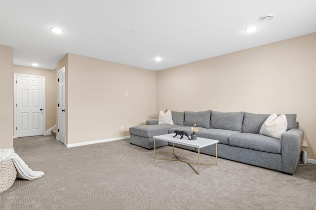 living area featuring carpet, baseboards, and recessed lighting