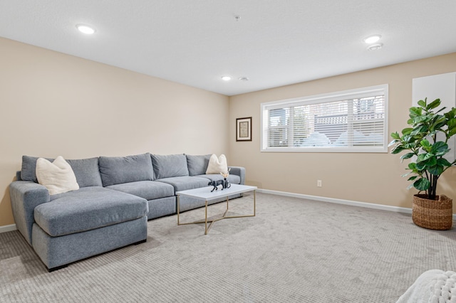 living room with recessed lighting, carpet flooring, and baseboards