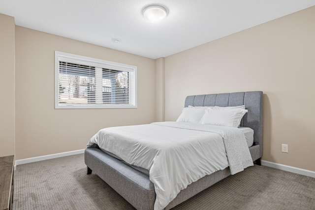 bedroom with carpet flooring and baseboards