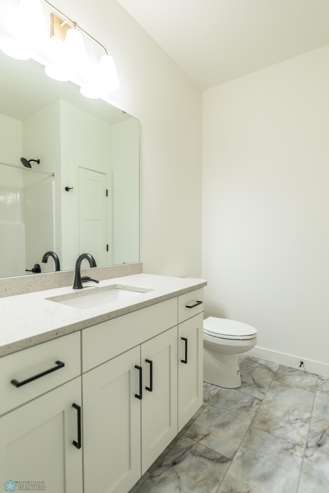 full bathroom with vanity, baseboards, walk in shower, toilet, and marble finish floor