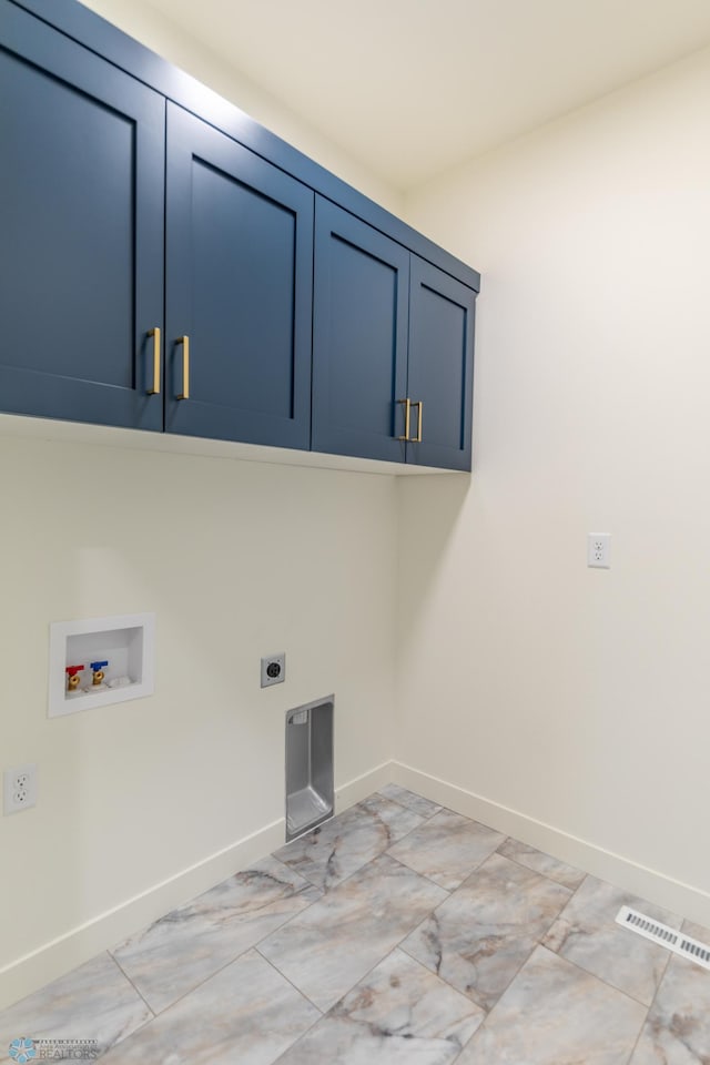 laundry area featuring hookup for a washing machine, visible vents, hookup for an electric dryer, baseboards, and cabinet space