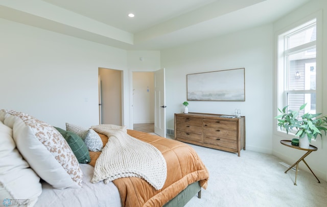 bedroom featuring light carpet, recessed lighting, and baseboards