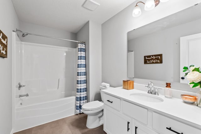 full bathroom featuring toilet, shower / tub combo with curtain, and vanity