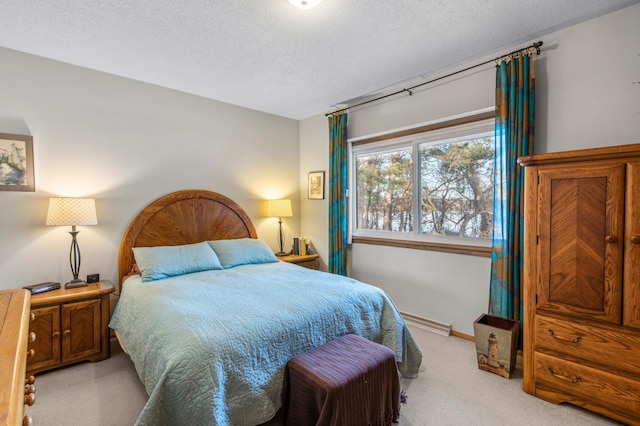 bedroom featuring carpet flooring, a textured ceiling, and baseboards