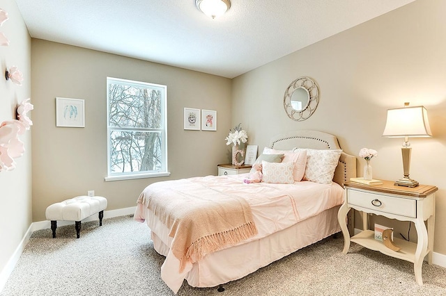 bedroom featuring carpet flooring and baseboards