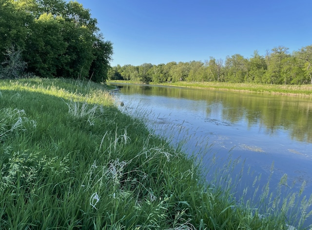 12424 126th Ave NE, Thief River Falls, MN 56701 - water view featuring a heavily wooded area